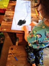 Revel making a painting of his favorite animal, an American Bison (Bison bison)